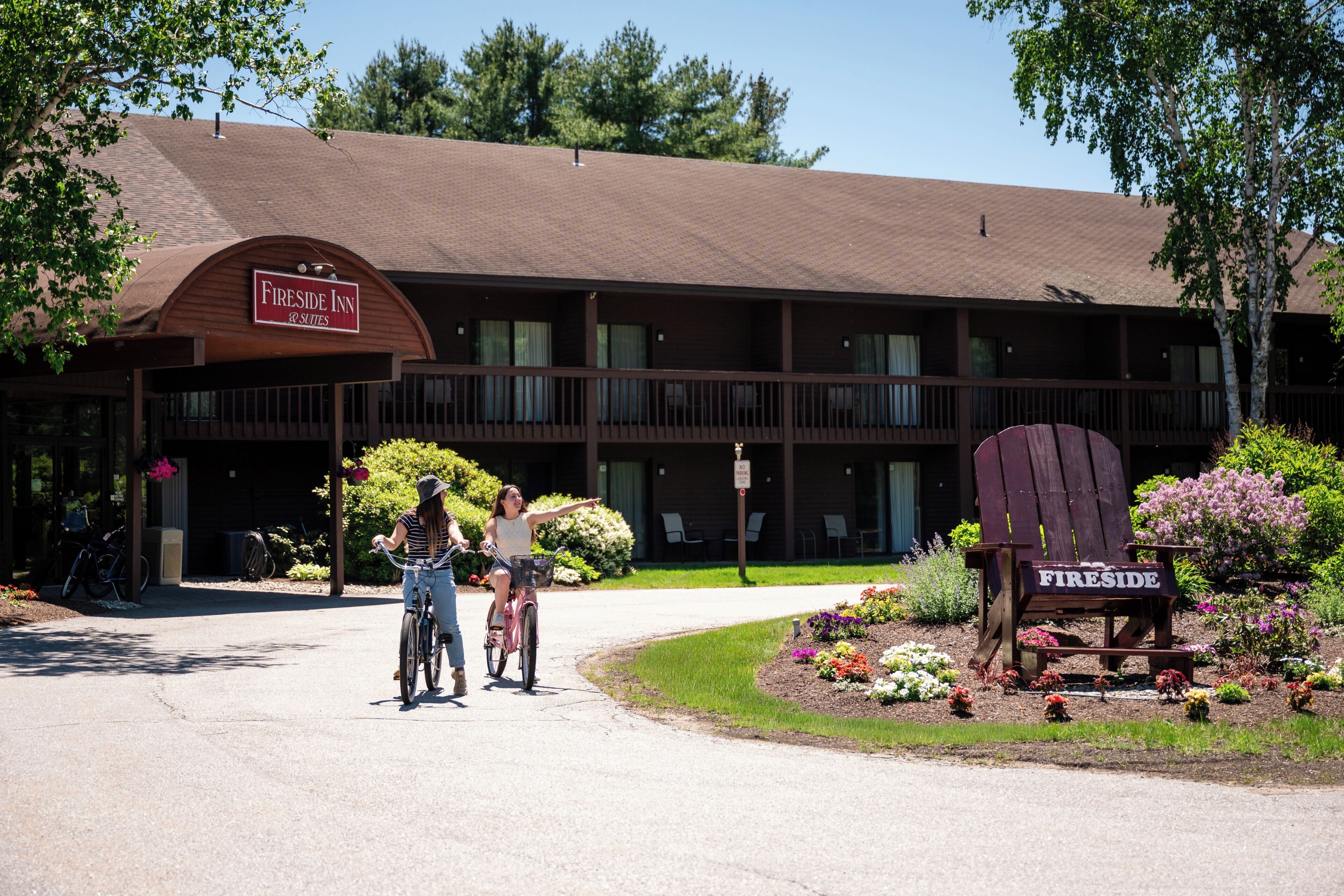 A Fireside Inn with a large sign, a covered porch, and a chair labeled 'FIRESIDE' in front.