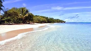 Beach nearby, white sand, beach towels