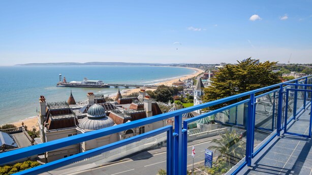 A coastal cityscape with a view of the sea, a bridge, and a beach. - Marsham Court Hotel (Bournemouth)