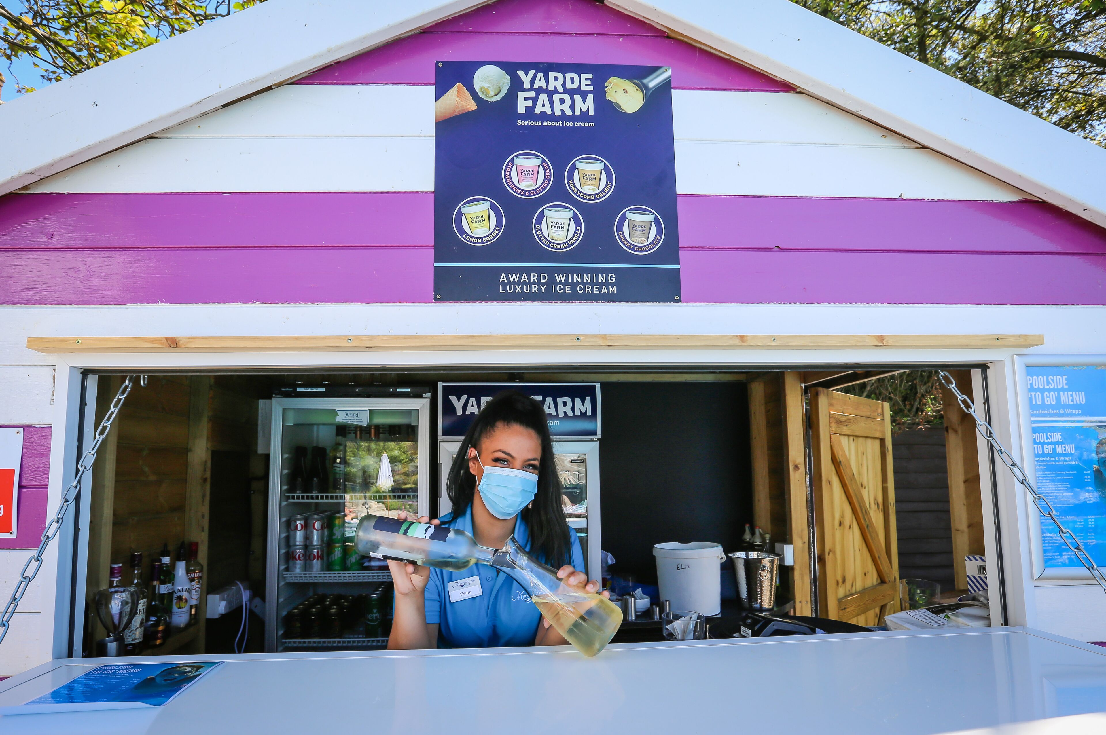 A food truck named Yarde Farm with a sign advertising award-winning luxury ice cream.