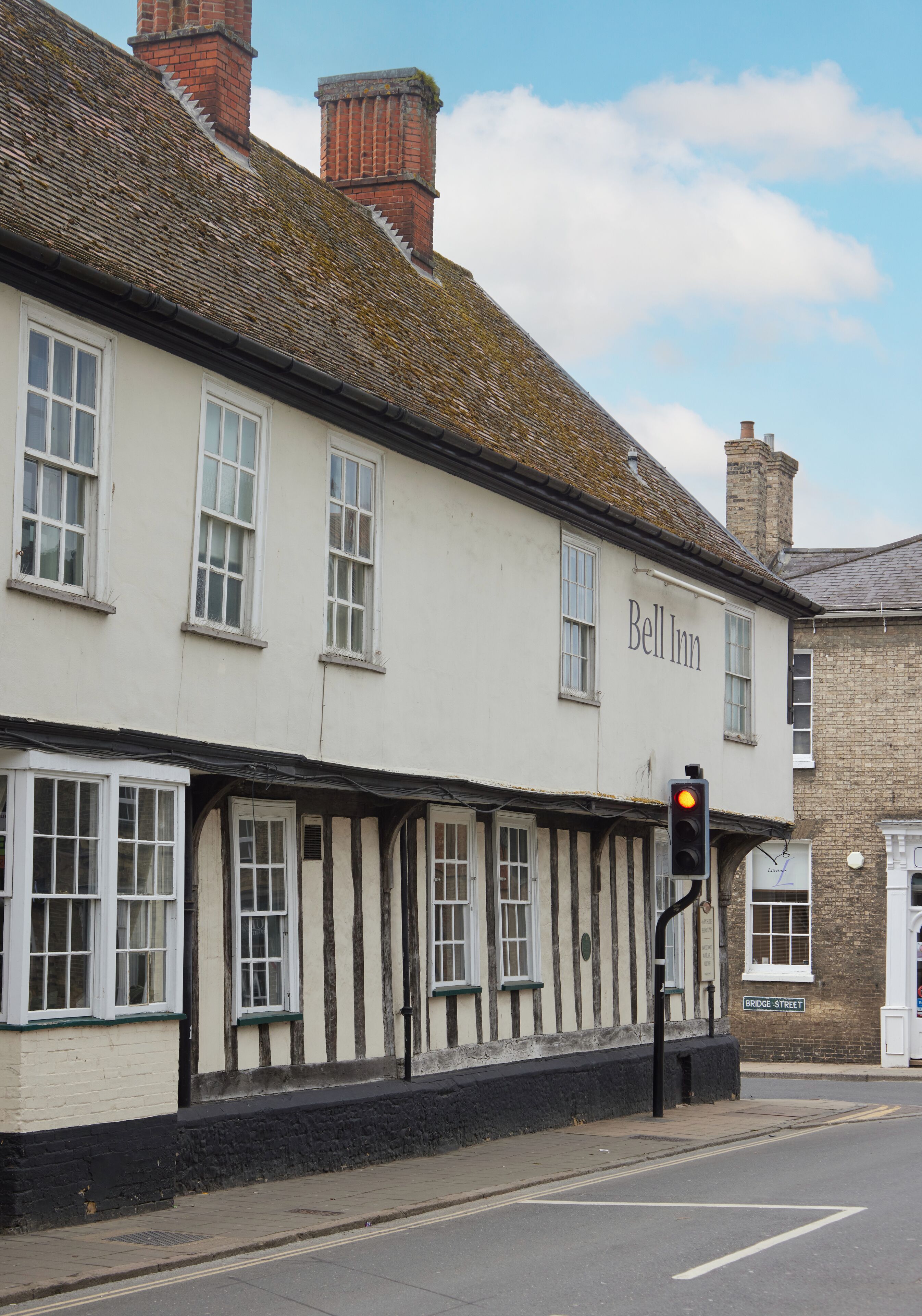 A traditional building with a sign reading "Bell Inn" on the facade.