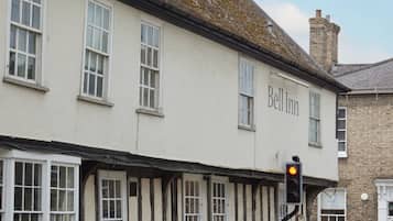 A traditional building with a sign reading "Bell Inn" on the facade.