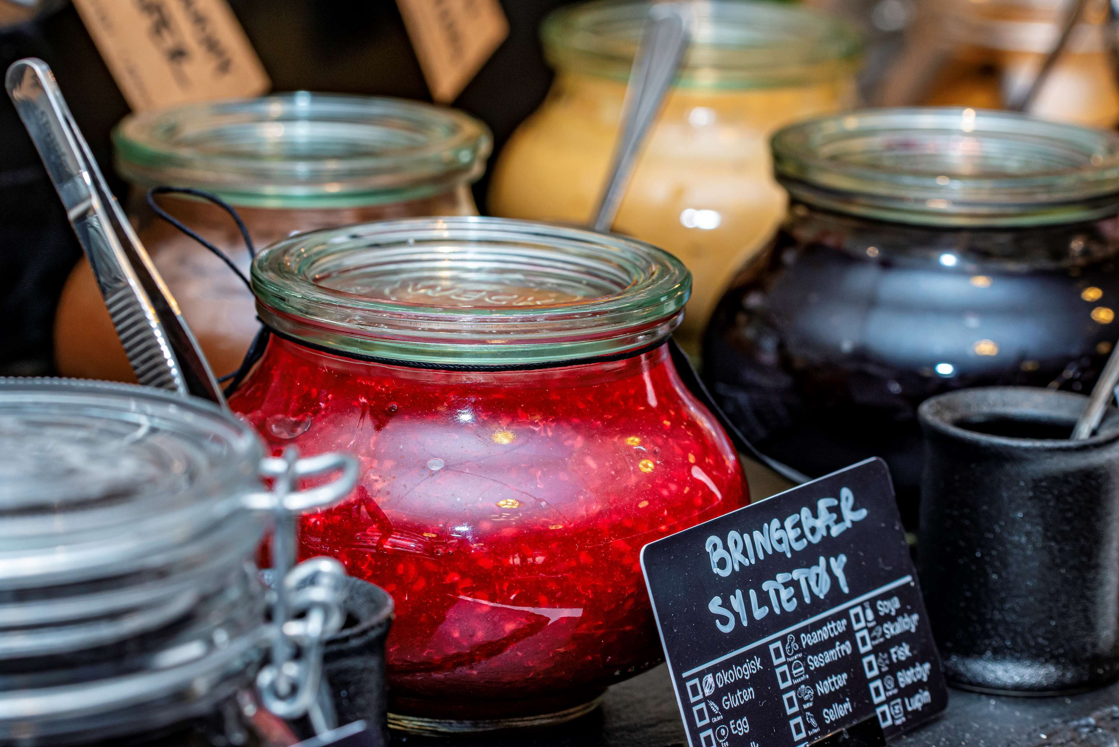 A variety of jars with different contents, some labeled with ingredients like gluten and soy.