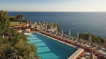 Outdoor pool, a rooftop pool, pool loungers