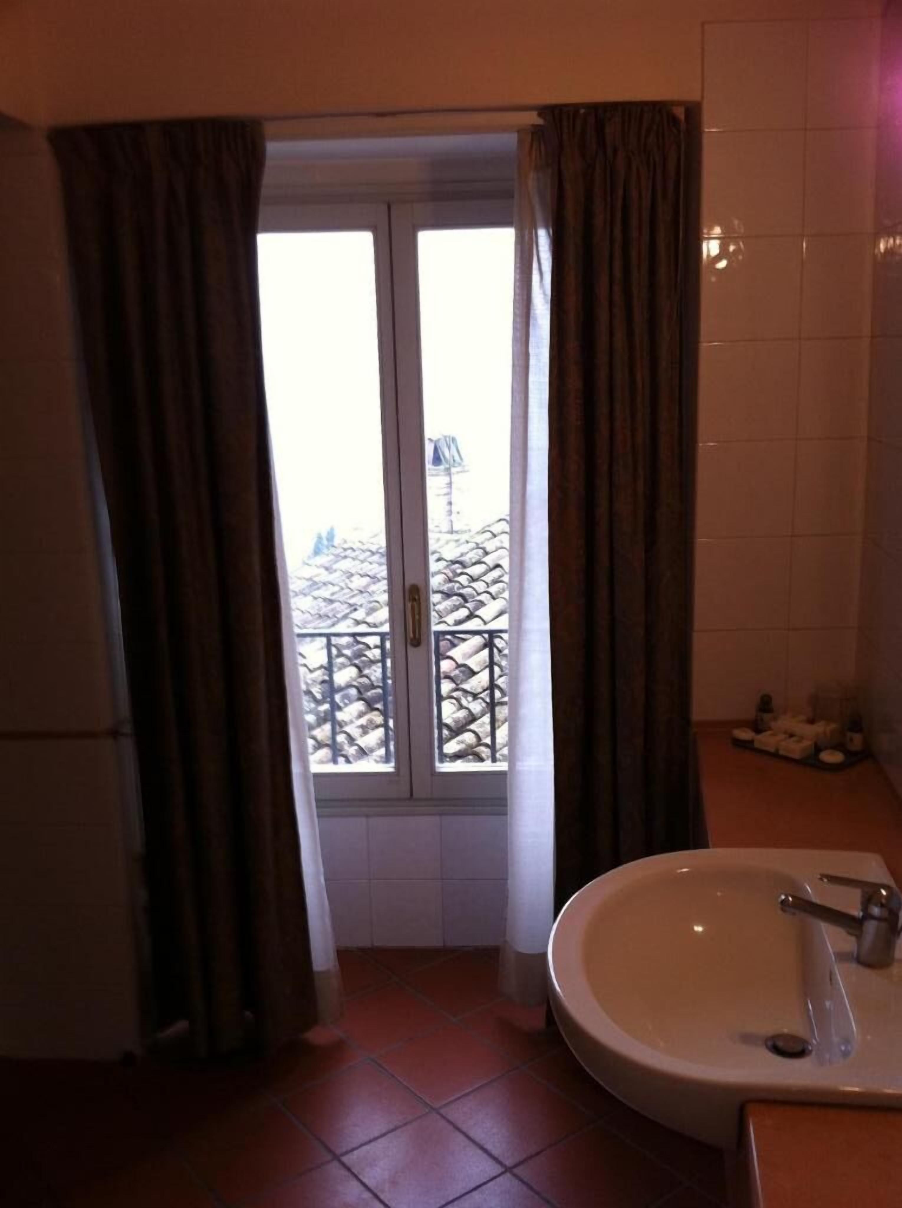 hair dryer, bathrobes, bidet, towels