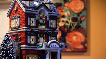 A model of a red brick building with a sign reading "Inn" on the front.