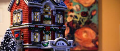 A model of a red brick building with a sign reading "Inn" on the front.
