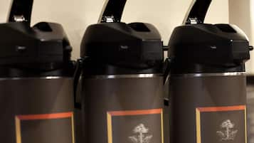 Three stainless steel water bottles with black lids and orange accents, labeled "Highridge Country Reserve Coffee Gourmet."