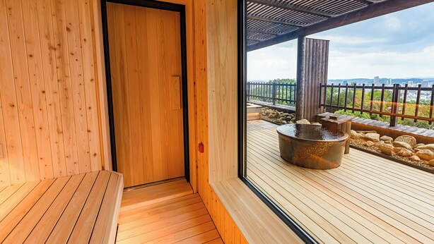 A wooden interior with a door leading to an outdoor deck area. - Okayama International Hotel (Okayama)