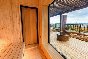 A wooden interior with a door leading to an outdoor deck area. - Okayama International Hotel (Okayama)
