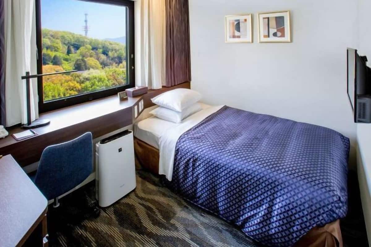 Down duvets, desk, blackout curtains, iron/ironing board