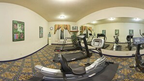 A gym with treadmills, an elliptical, and a stationary bike. - Holiday Inn Express Hotel & Suites Sherman Highway 75 by IHG (Sherman)