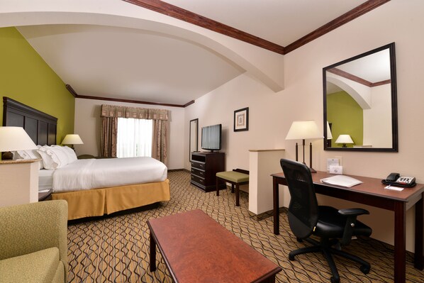 A hotel room with a bed, desk, chair, and a television. - Holiday Inn Express Hotel & Suites Sherman Highway 75 by IHG (Sherman)