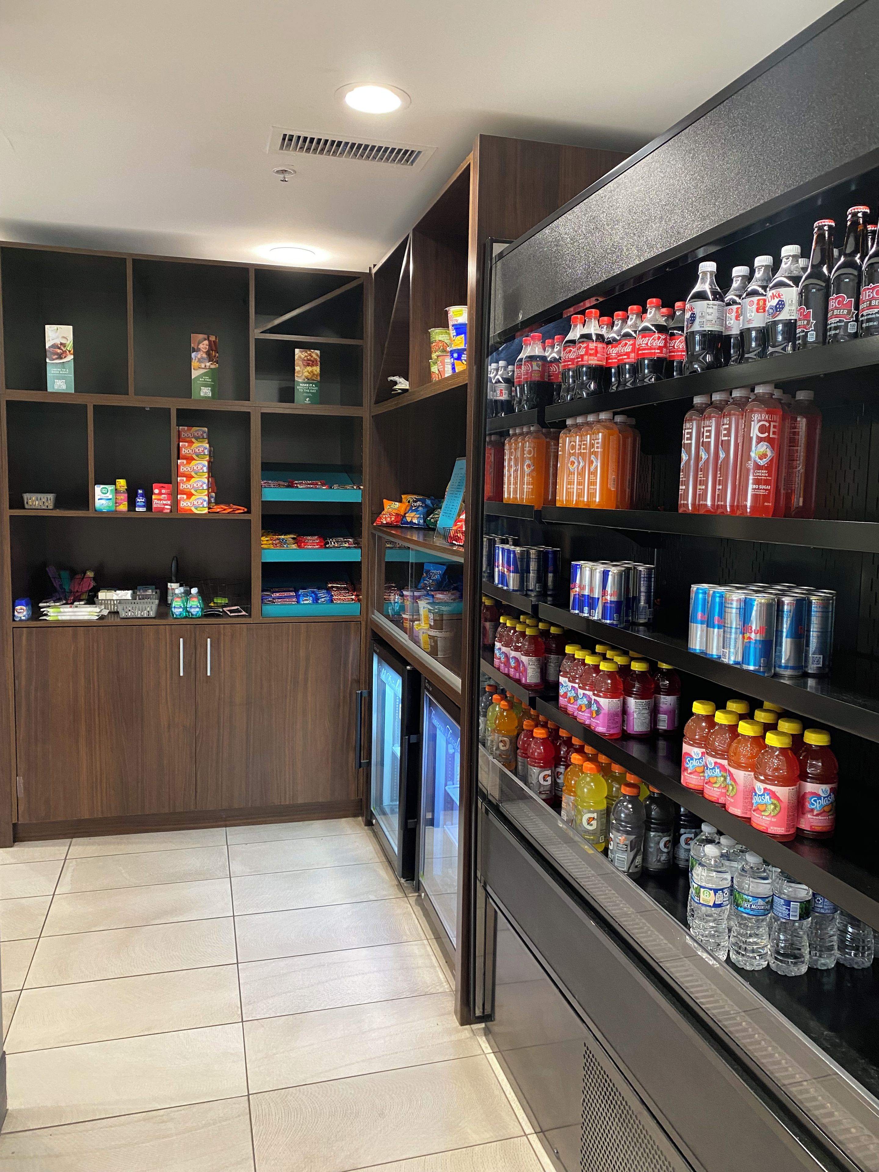 A beverage section with various drinks and snacks.