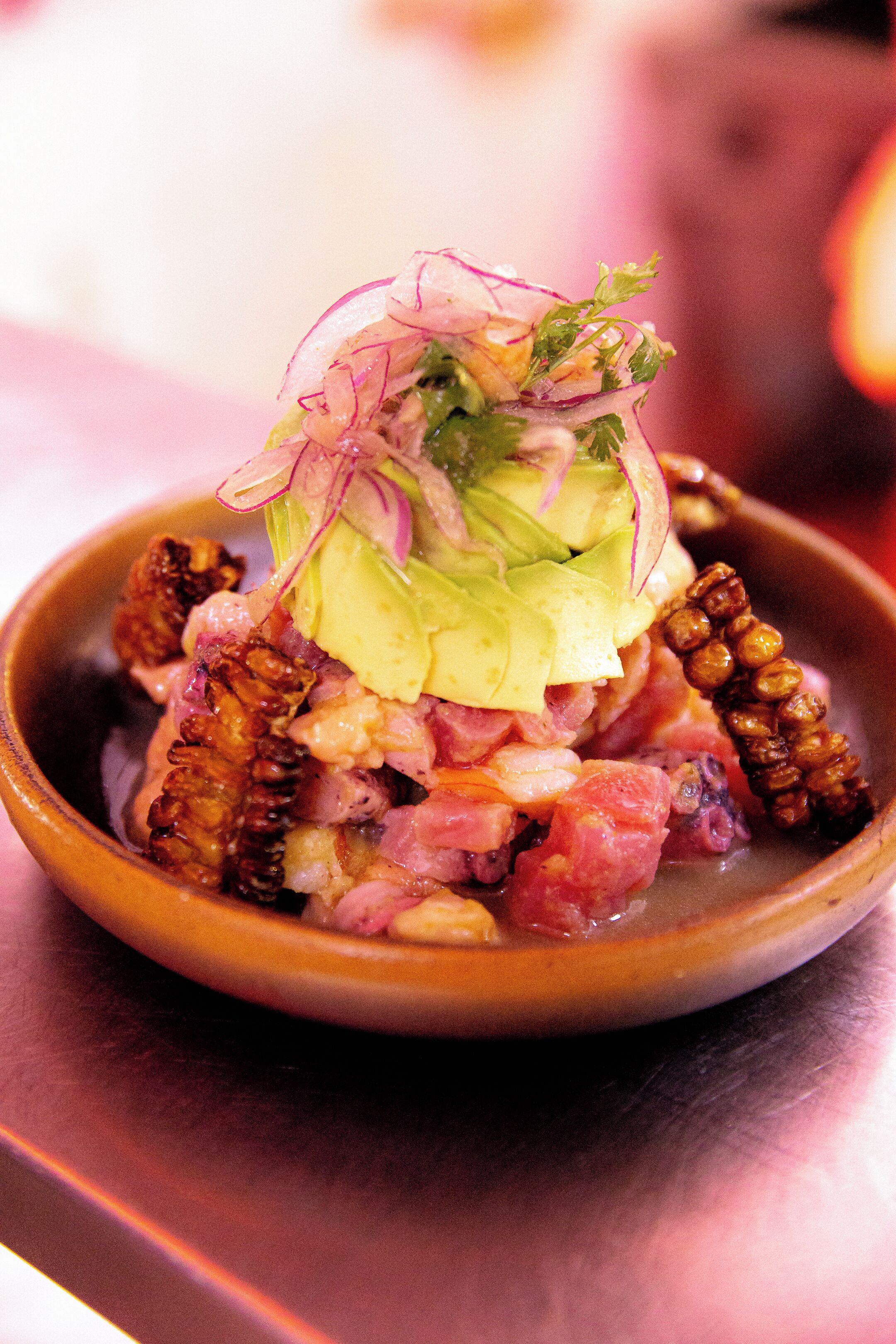 A bowl of food with various ingredients.