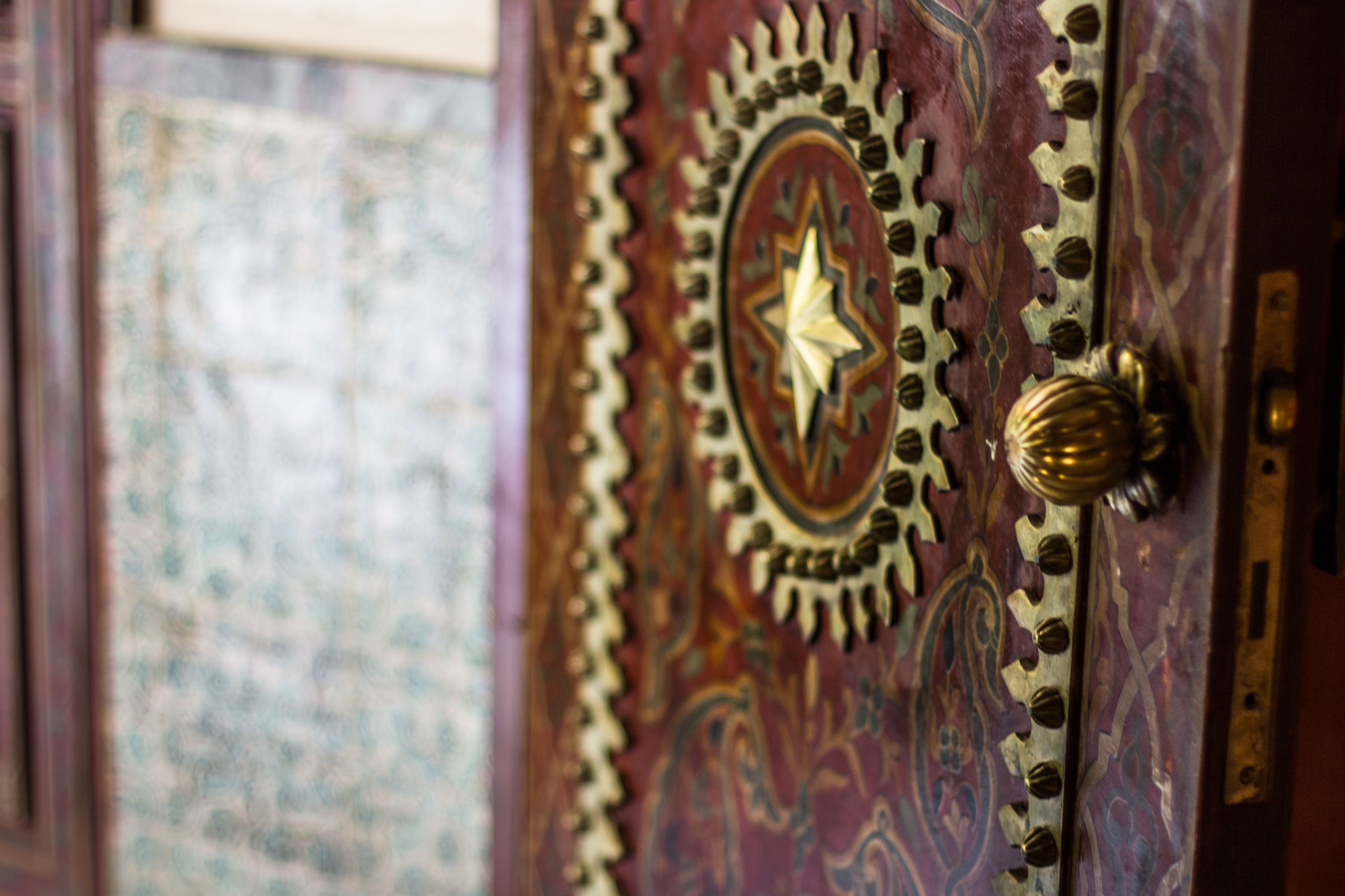 A door with intricate designs and a star emblem.