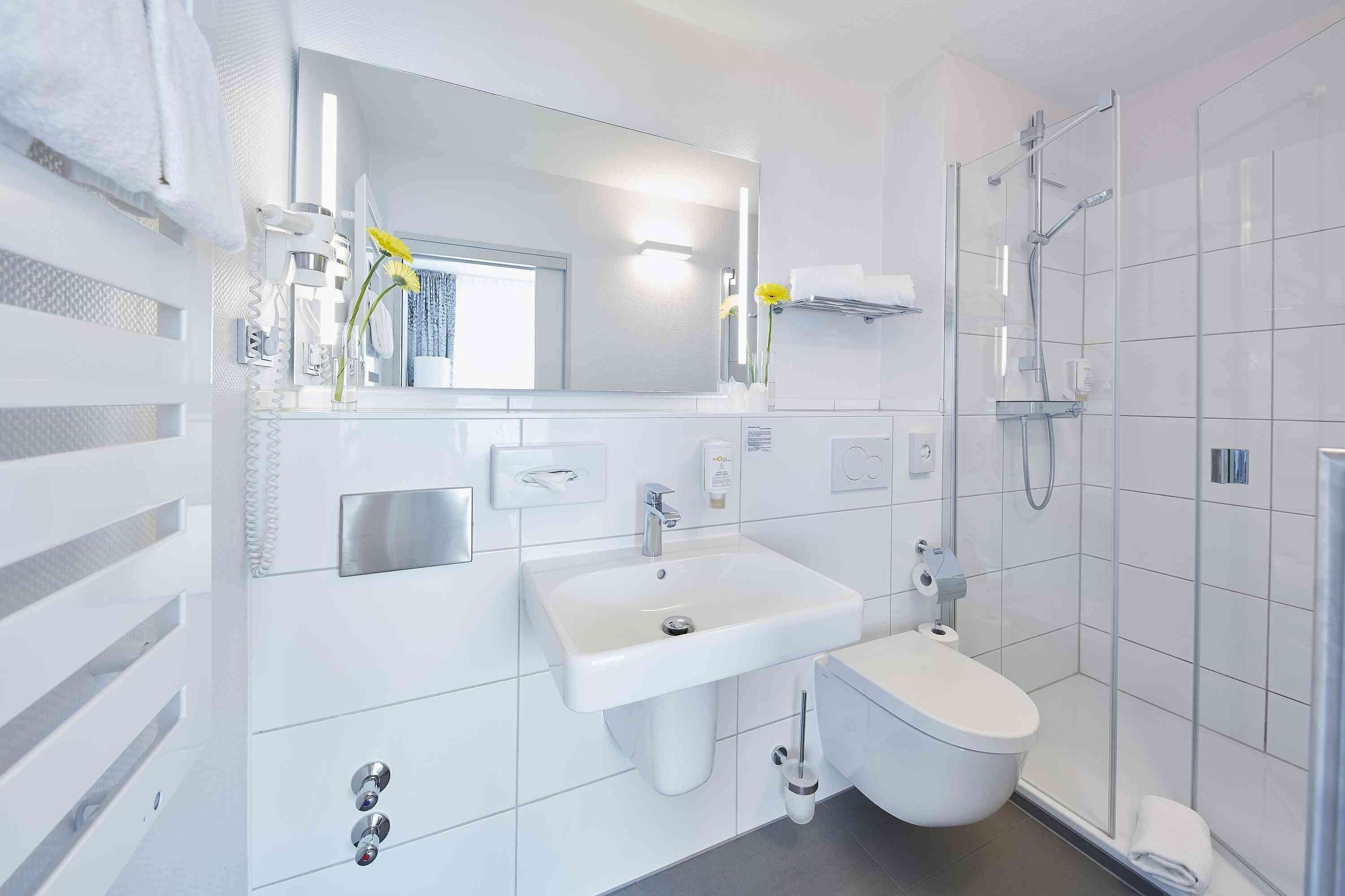 shower, eco-friendly toiletries, hair dryer, towels