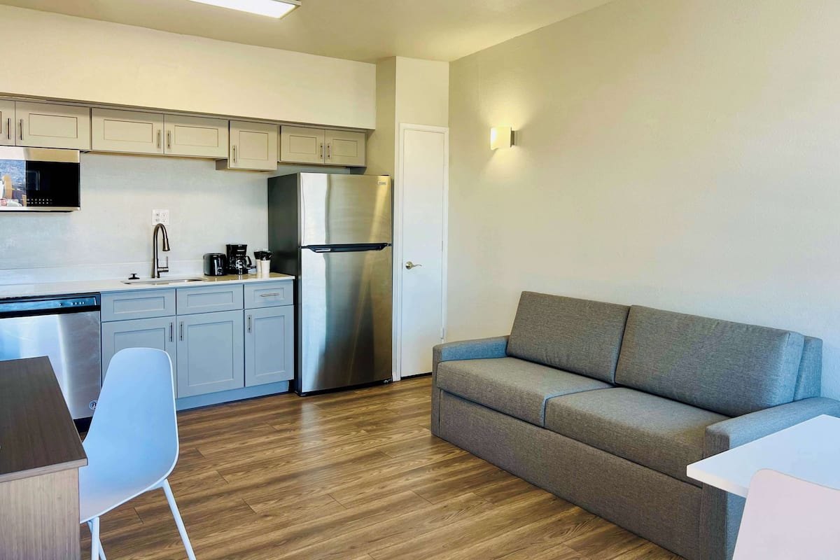 Standard Suite, 1 Queen Bed, Non Smoking, Kitchenette | Iron/ironing board, free WiFi, bed sheets