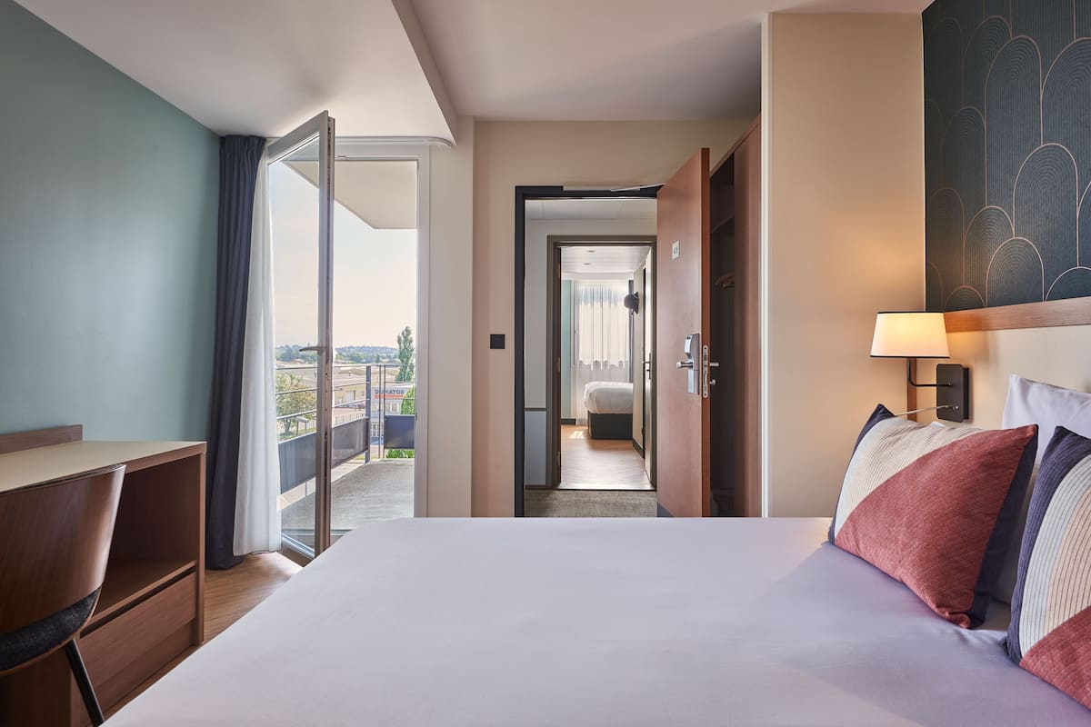 Family Room | Premium bedding, desk, soundproofing, iron/ironing board