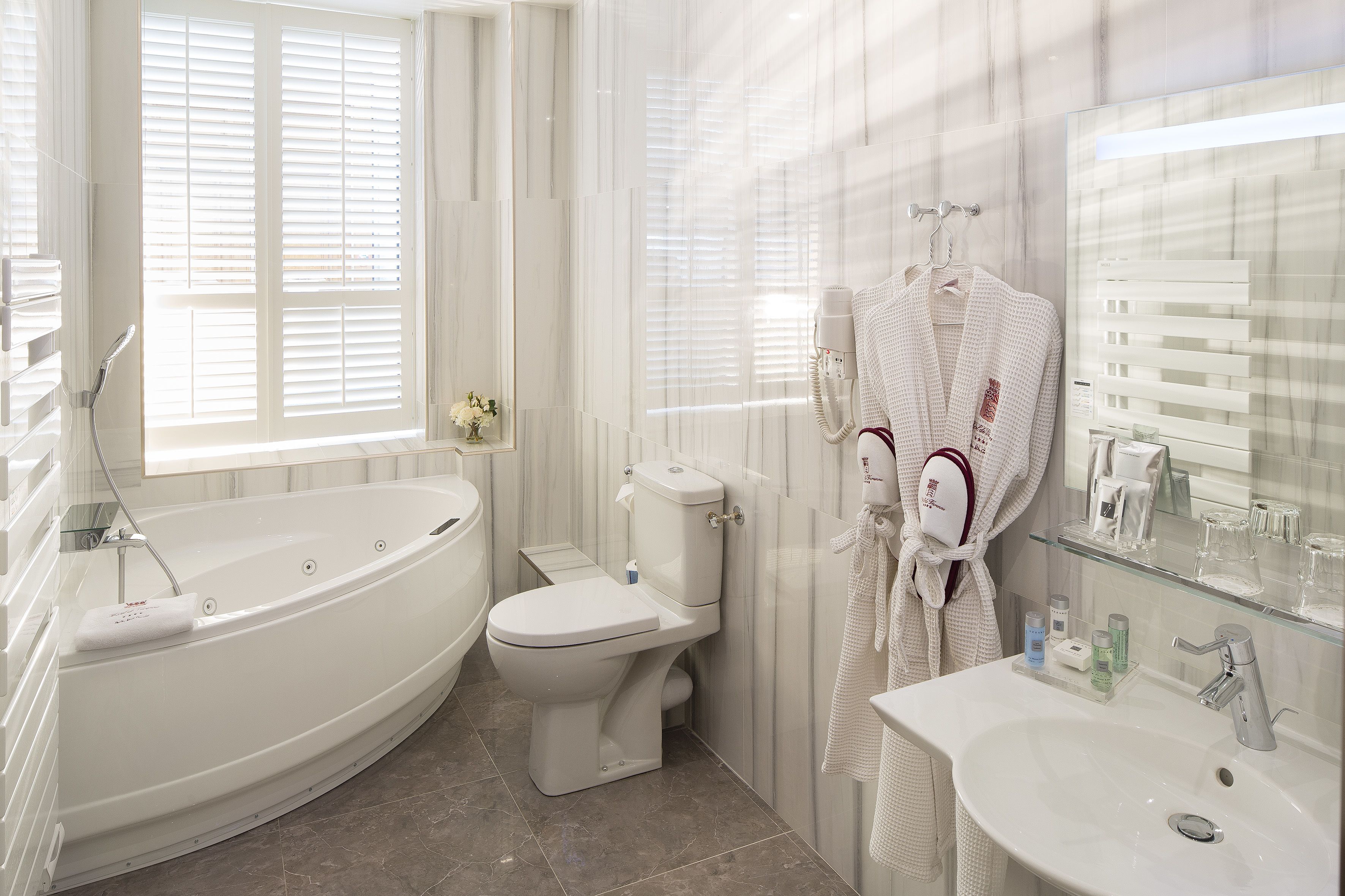 suite | bathroom | hair dryer, bathrobes, slippers, towels