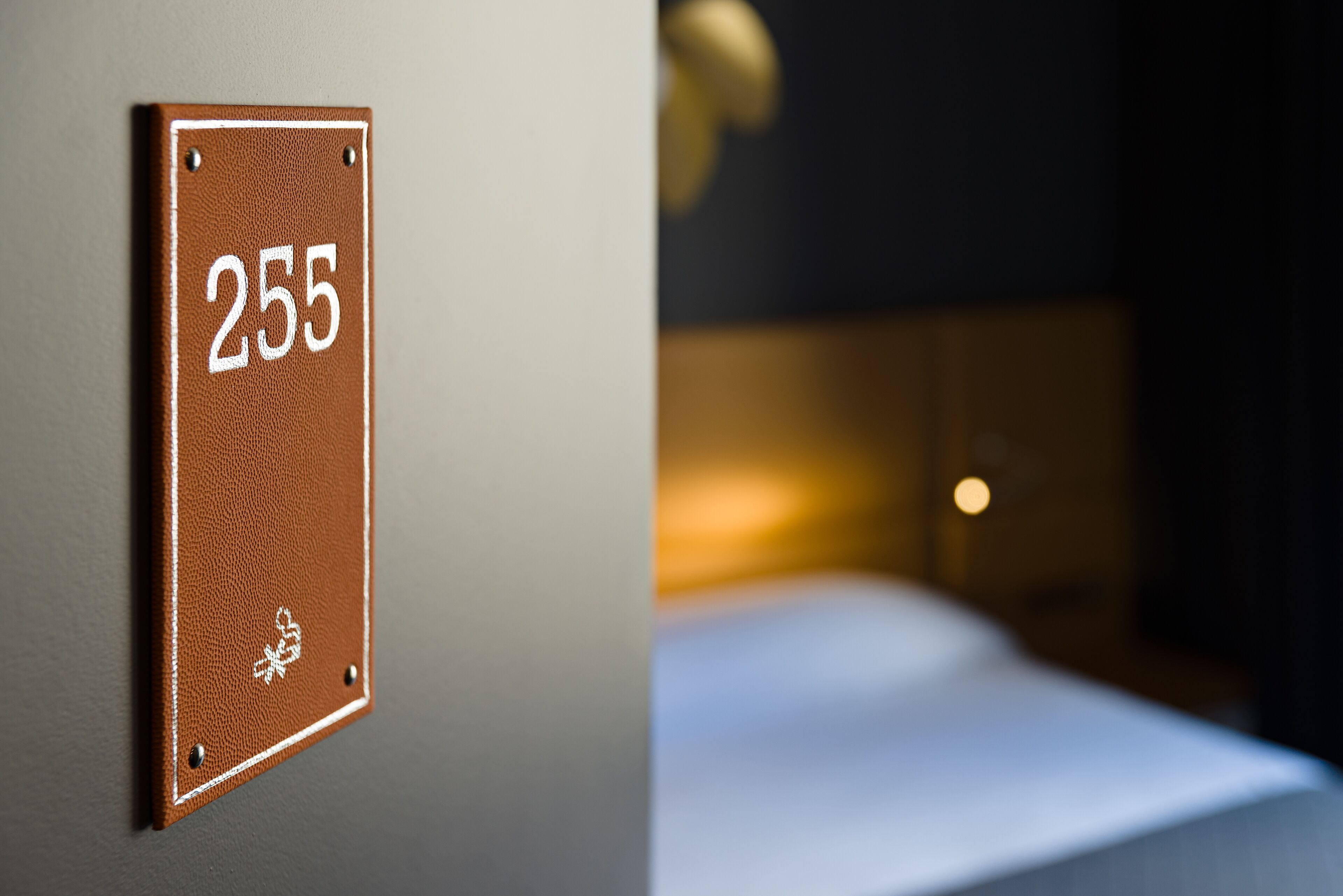 A wall-mounted sign with the number 255.