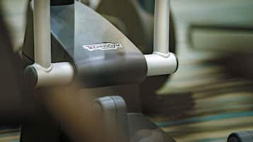 A close-up of a gym equipment with the brand name "Technogym" visible.
