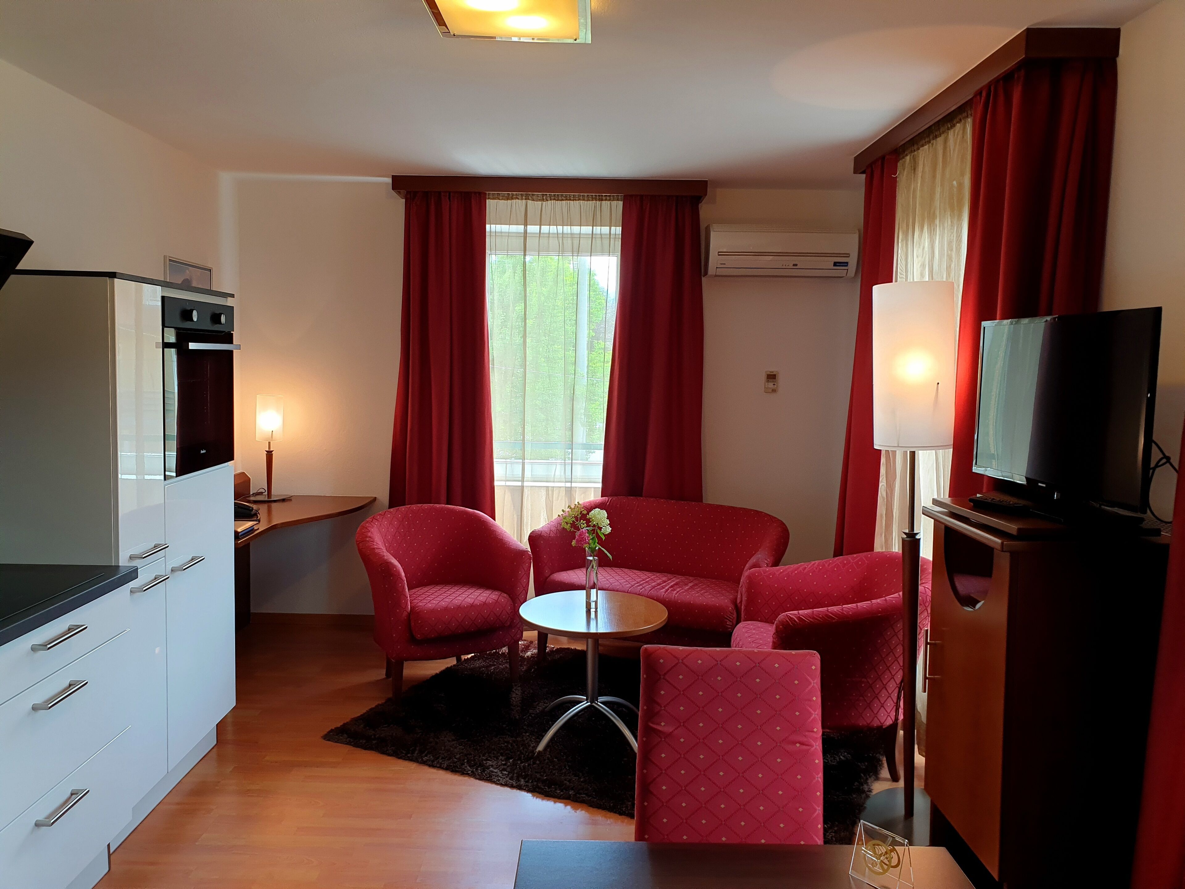 deluxe apartment | living area | tv