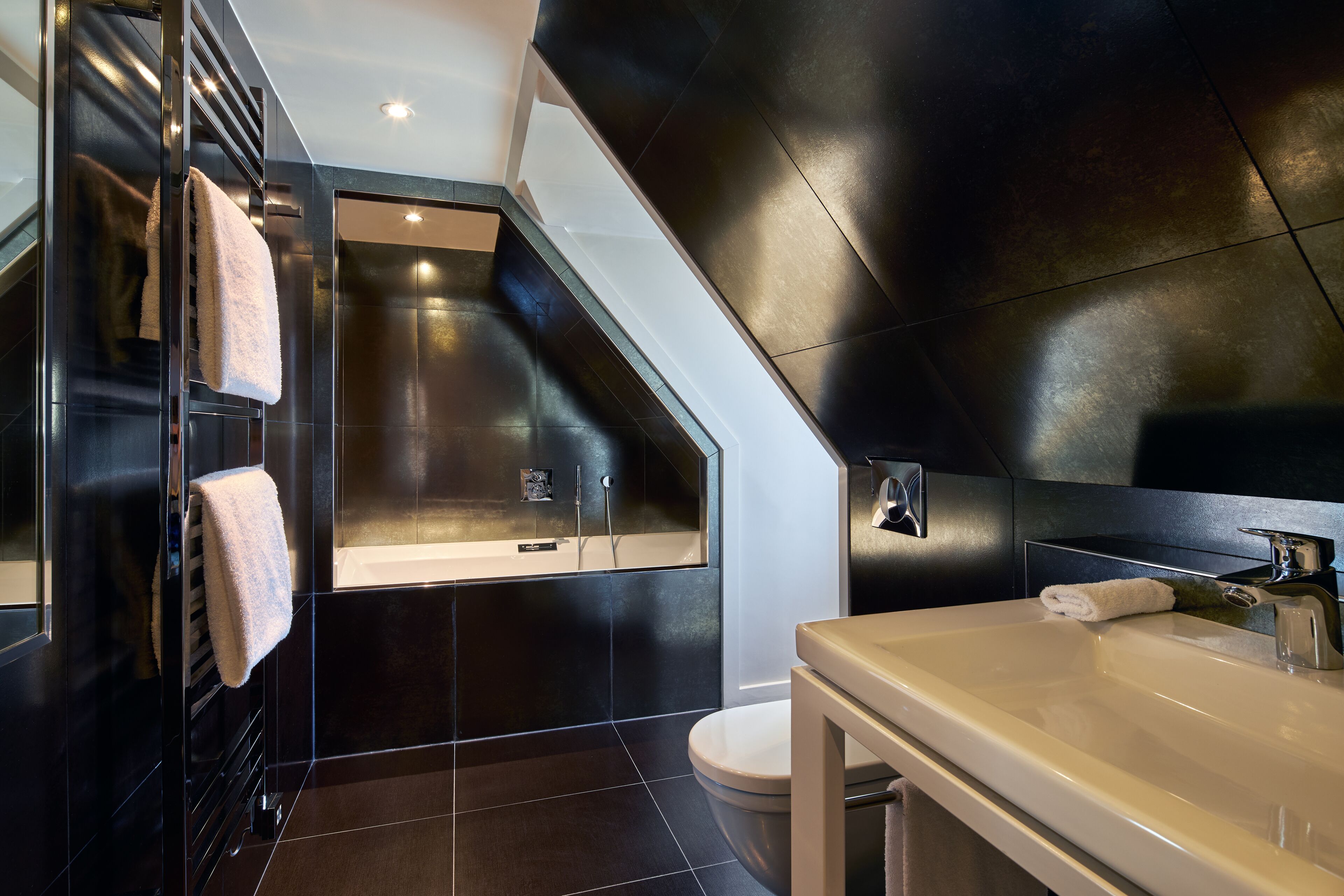 junior suite | bathroom | designer toiletries, hair dryer, bathrobes, slippers