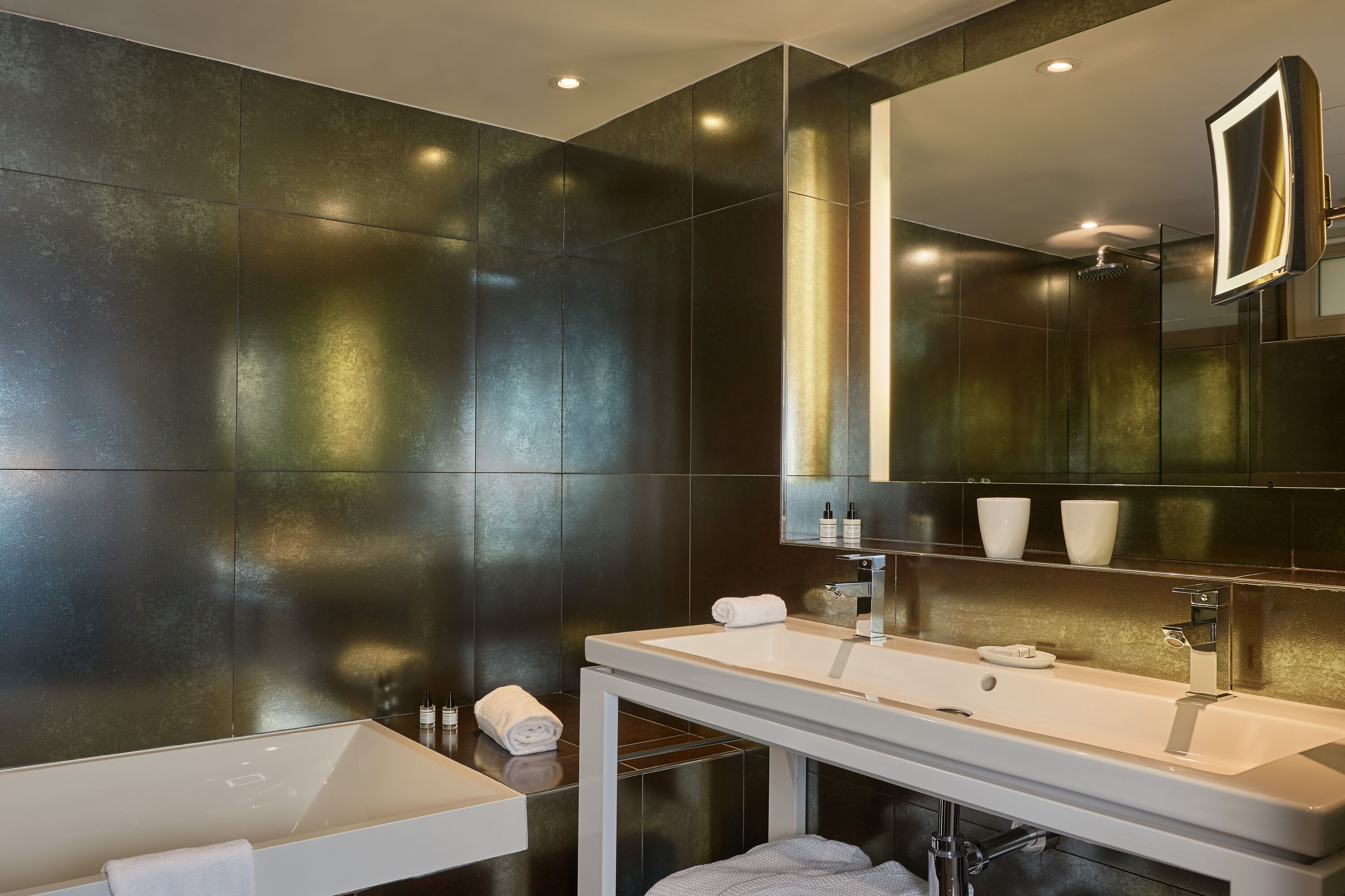 designer toiletries, hair dryer, bathrobes, slippers