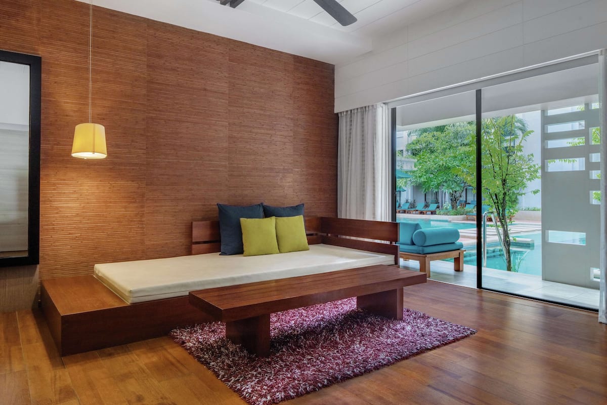 Premium Suite, 1 Bedroom, Pool Access | Living area | 42-inch LCD TV with digital channels, TV