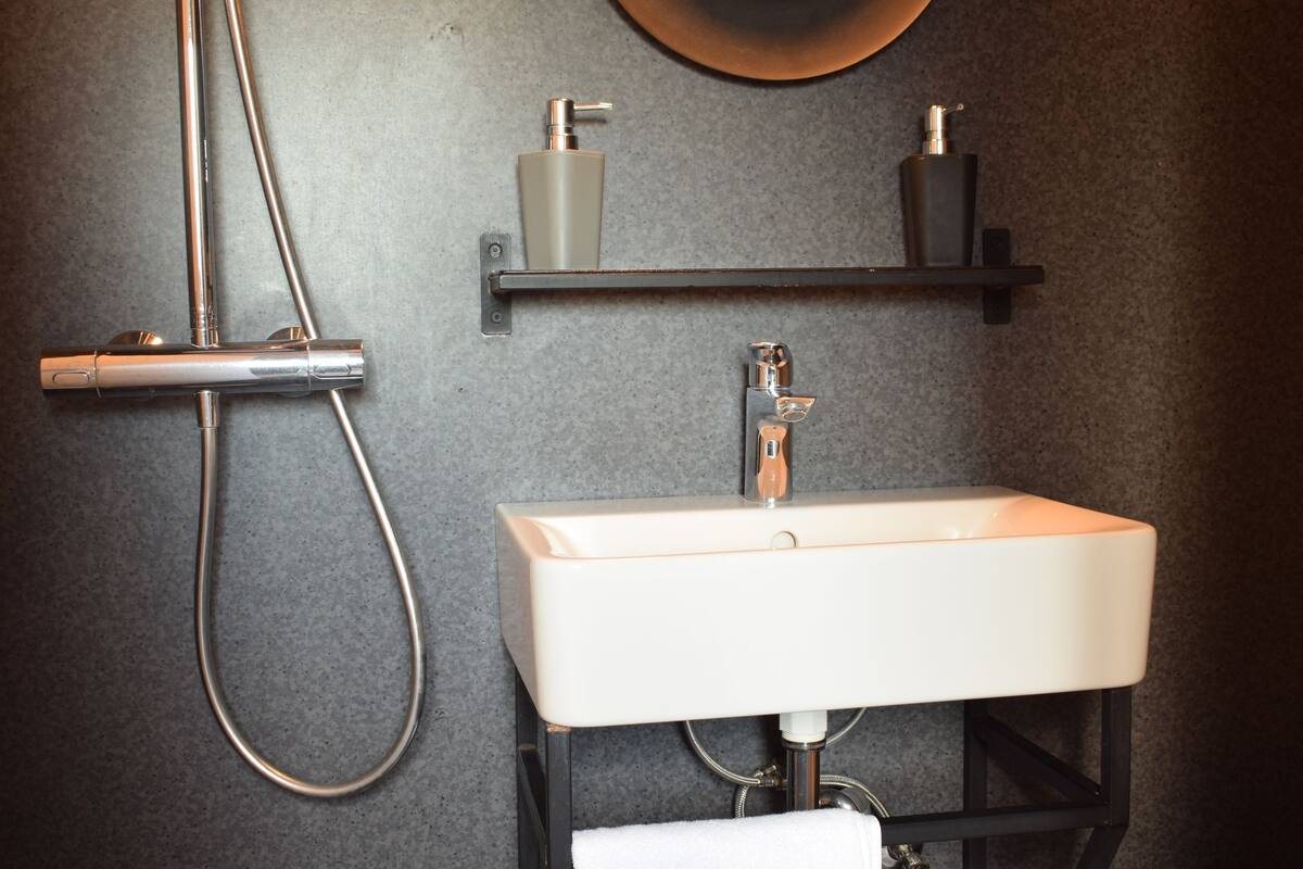 panoramic room with church view | bathroom | shower, hair dryer, towels