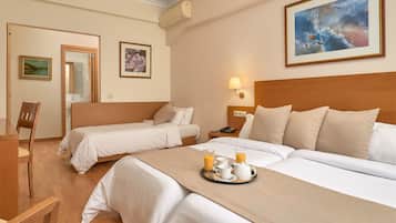 Triple Room | Minibar, in-room safe, desk, laptop workspace