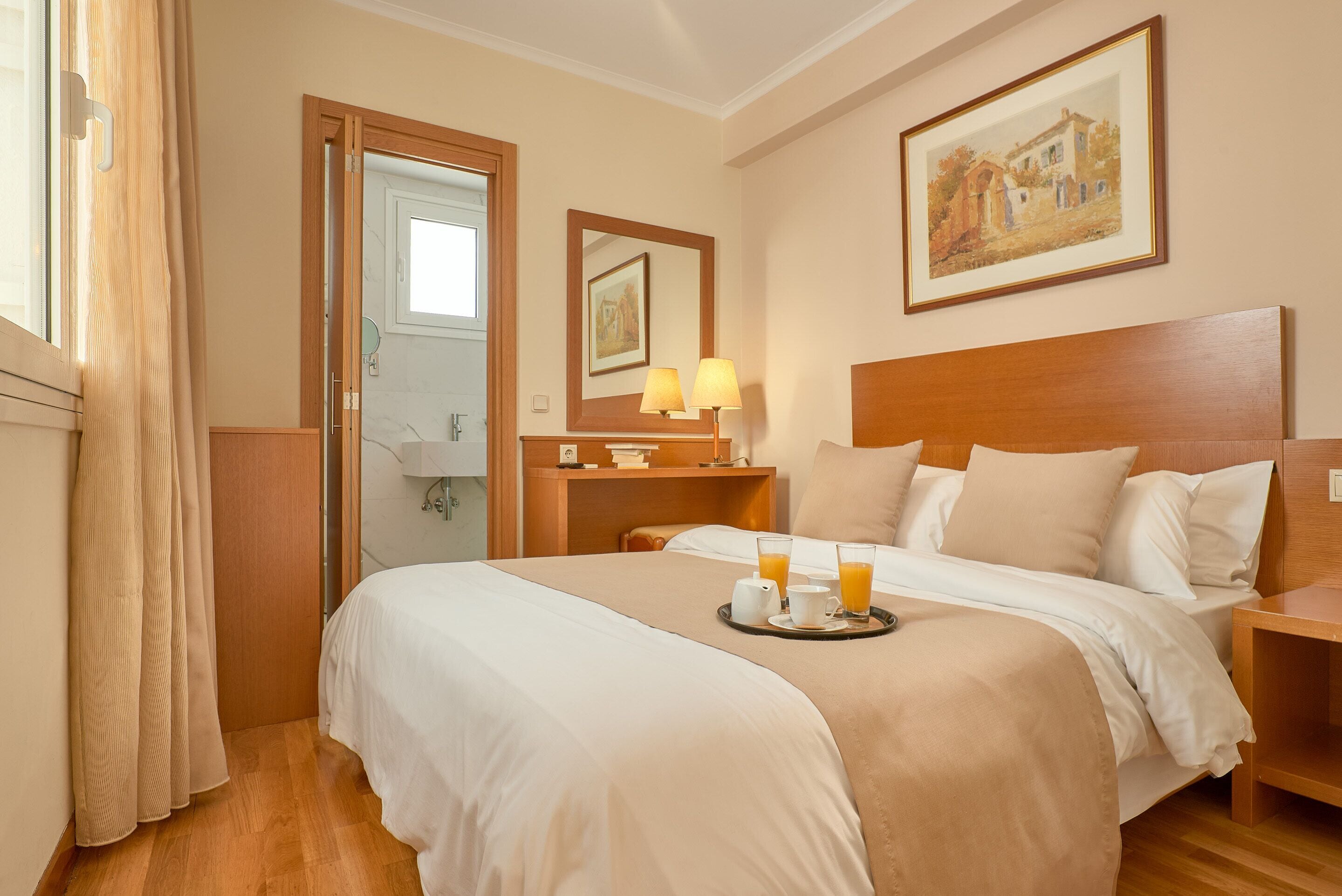 superior double or twin room | minibar, in-room safe, desk, laptop workspace