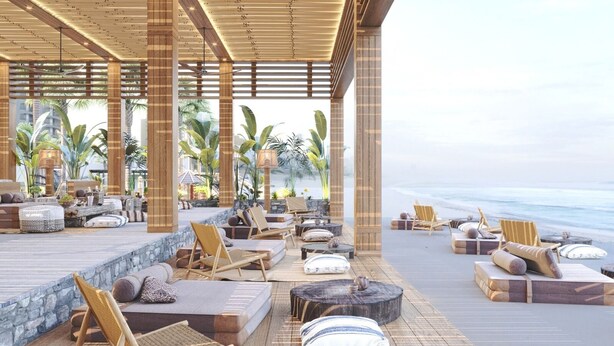 A beachside lounge area with wooden flooring, cushioned seating, and a view of the ocean. - Megasaray Club Belek (Serik)