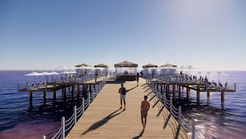 Plage privée, cabines (en supplément), chaises longues, parasols