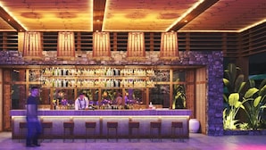 A bar area with a stone facade, wooden ceiling, and bar stools. - Megasaray Club Belek (Serik)