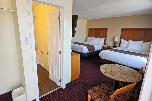 Standard Room, 2 Queen Beds | Desk, iron/ironing board, free WiFi, bed sheets