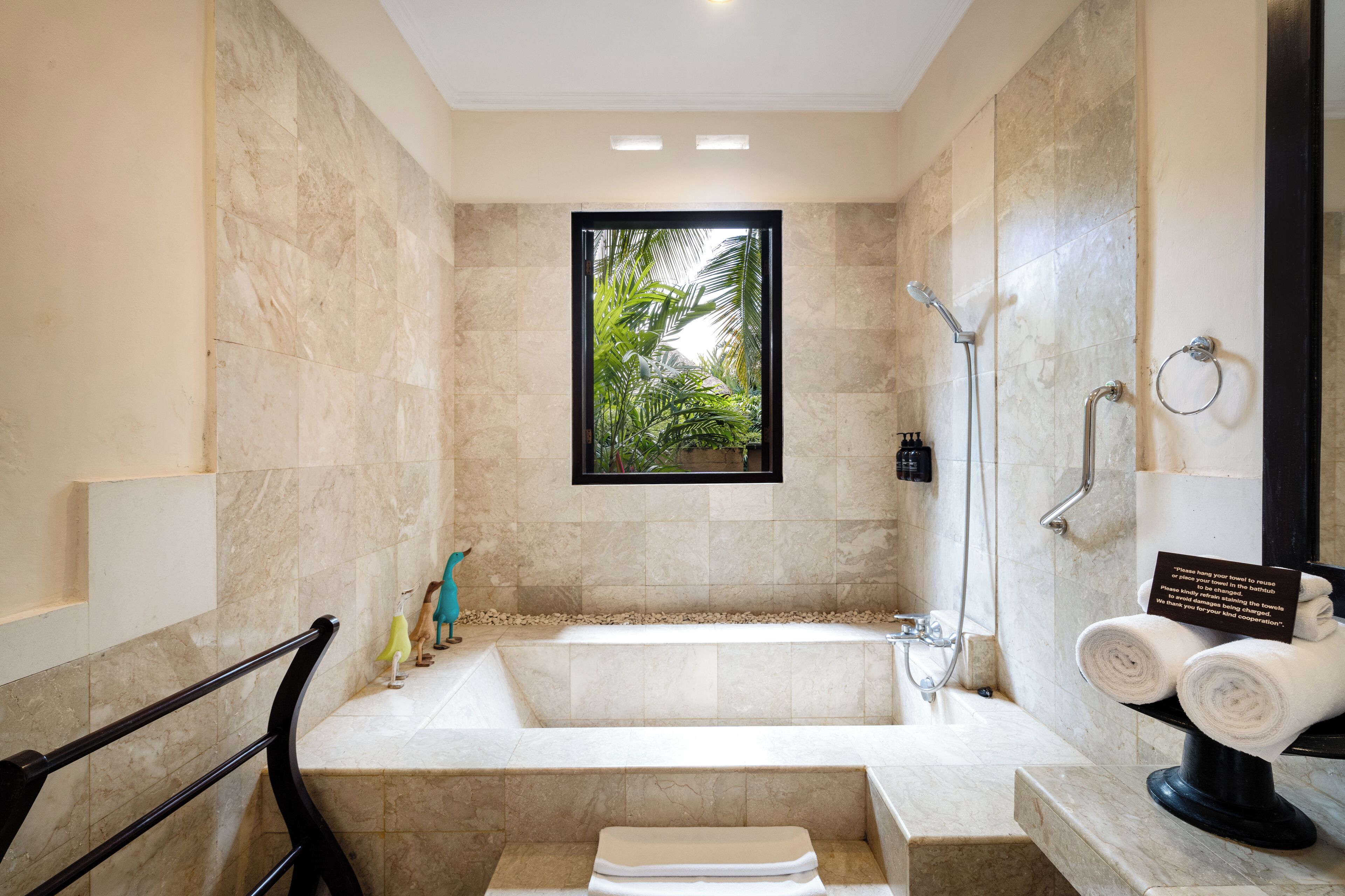 designer toiletries, hair dryer, slippers, bidet