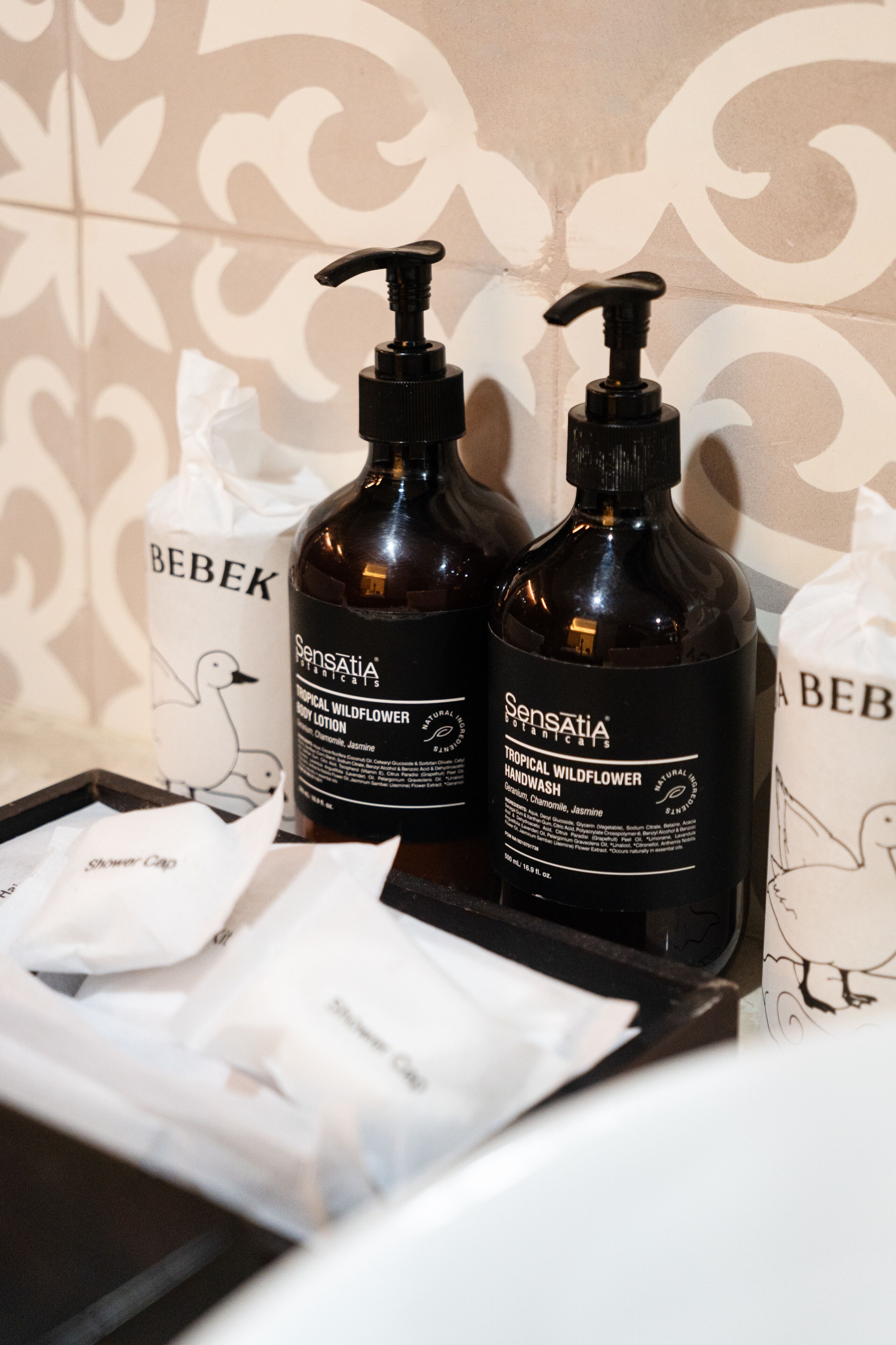 designer toiletries, hair dryer, slippers, bidet