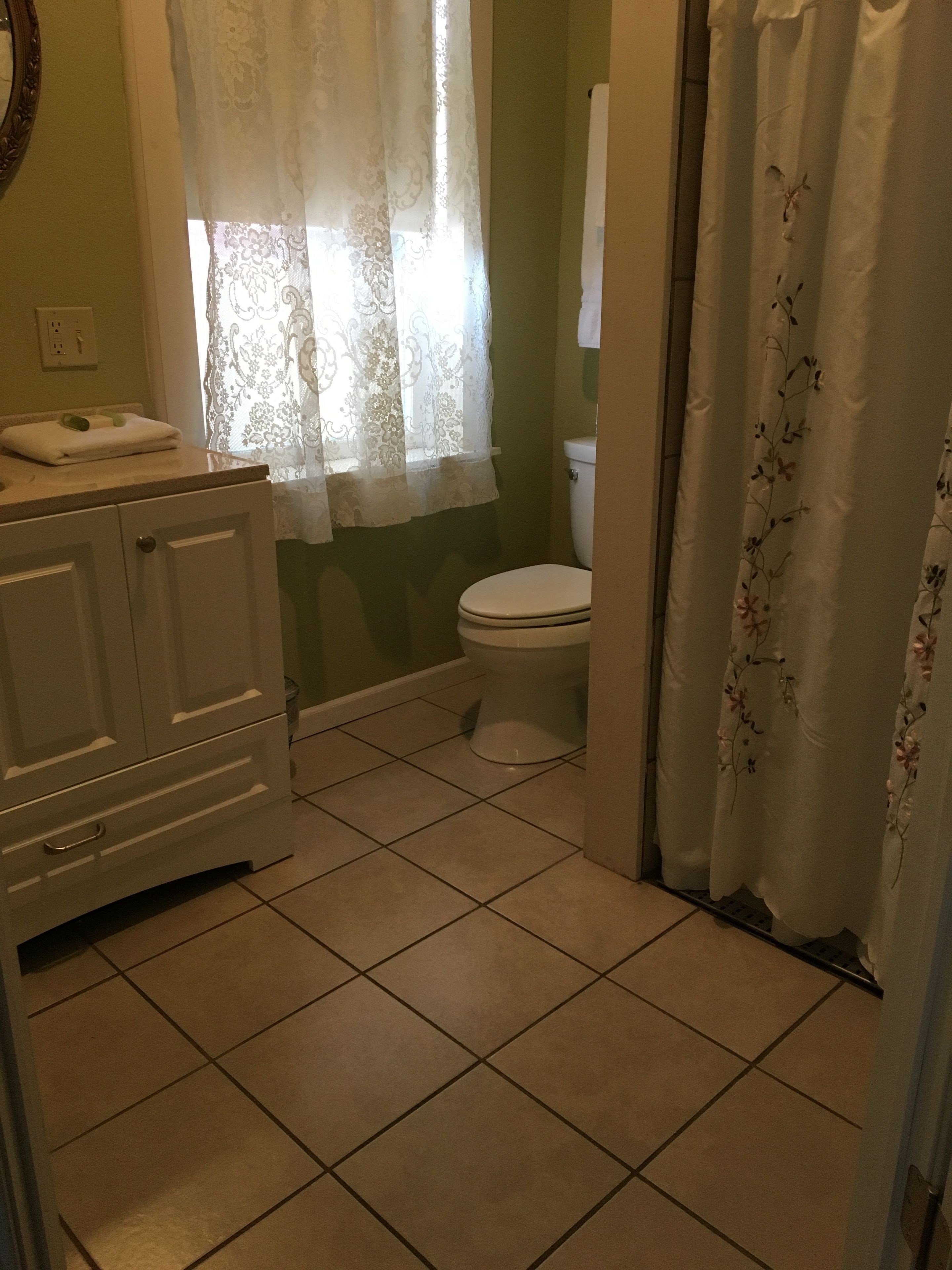room (room #16, king bed) | bathroom | combined shower/bathtub, towels