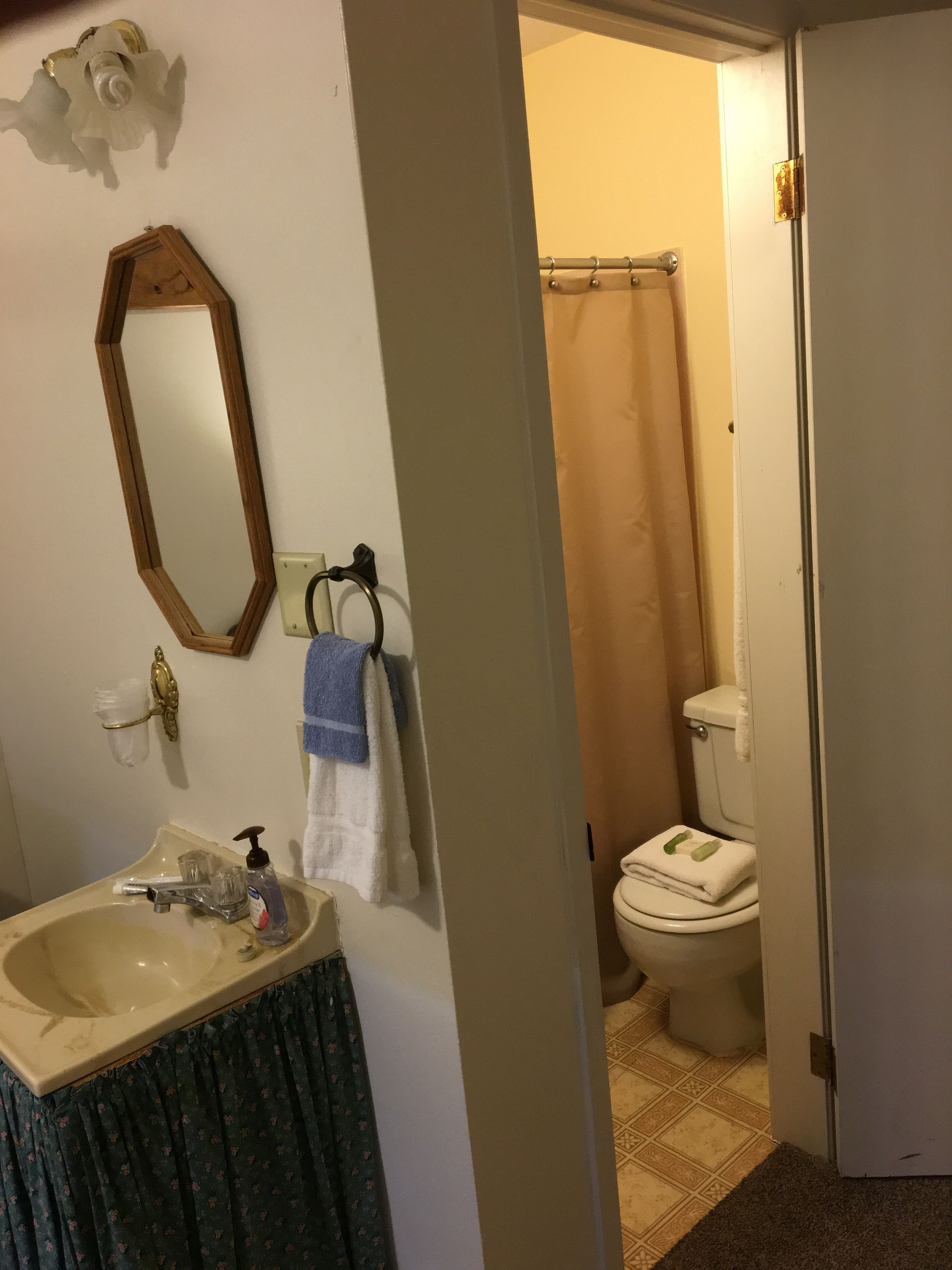 room (room #11, queen bed) | bathroom | combined shower/bathtub, towels