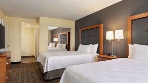 A hotel room with two beds, a TV, a mirror, and a lamp. - Homewood Suites by Hilton Allentown-Bethlehem Airport (Bethlehem)