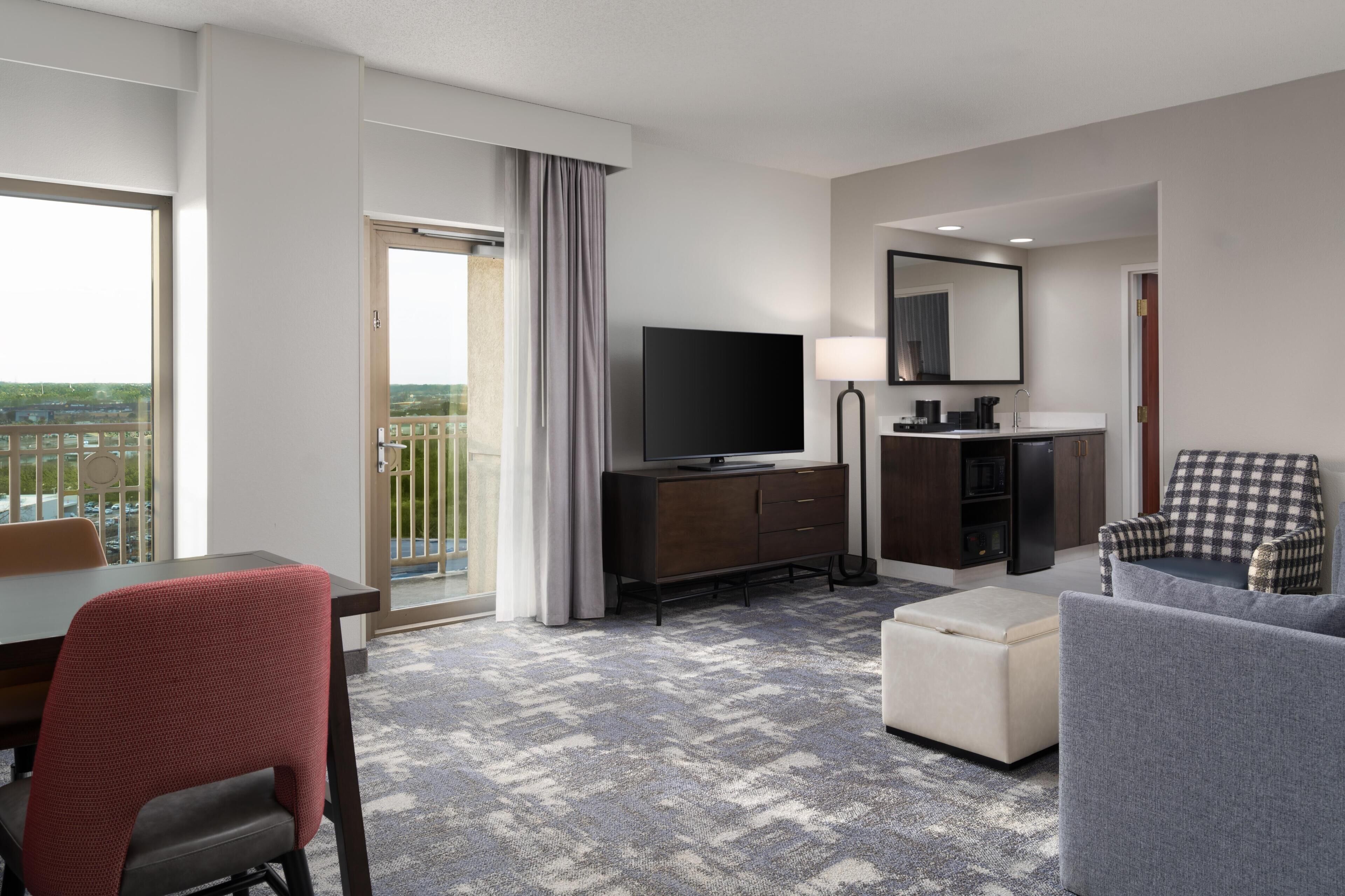 Room, 2 Queen Beds, Corner | Living area | 32-inch LCD TV with cable channels, TV, pay movies