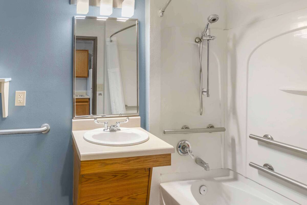 combined shower/bathtub, hair dryer, towels, soap