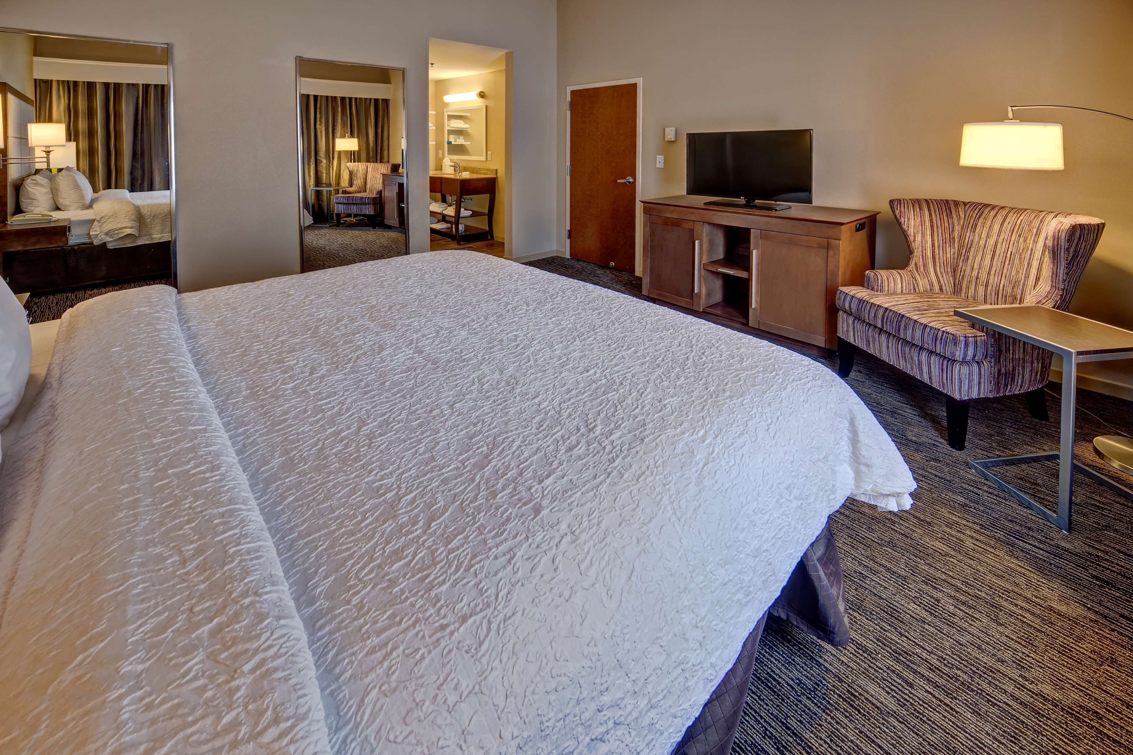suite, one king bed, non-smoking | in-room safe, desk, blackout curtains, iron/ironing board