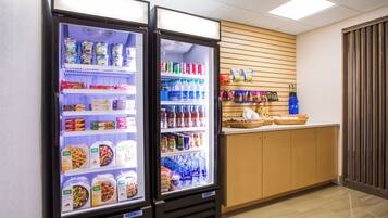 A refrigerated display case with various food items and beverages.