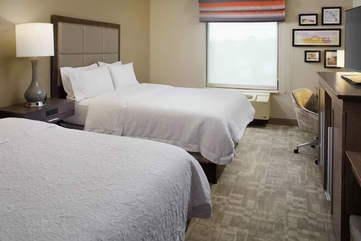 Desk, laptop workspace, iron/ironing board, free cribs/infant beds