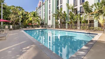 Outdoor pool, open 9:00 AM to 9:00 PM, pool loungers