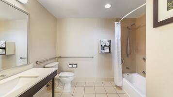 A modern bathroom with a sink, toilet, and shower.