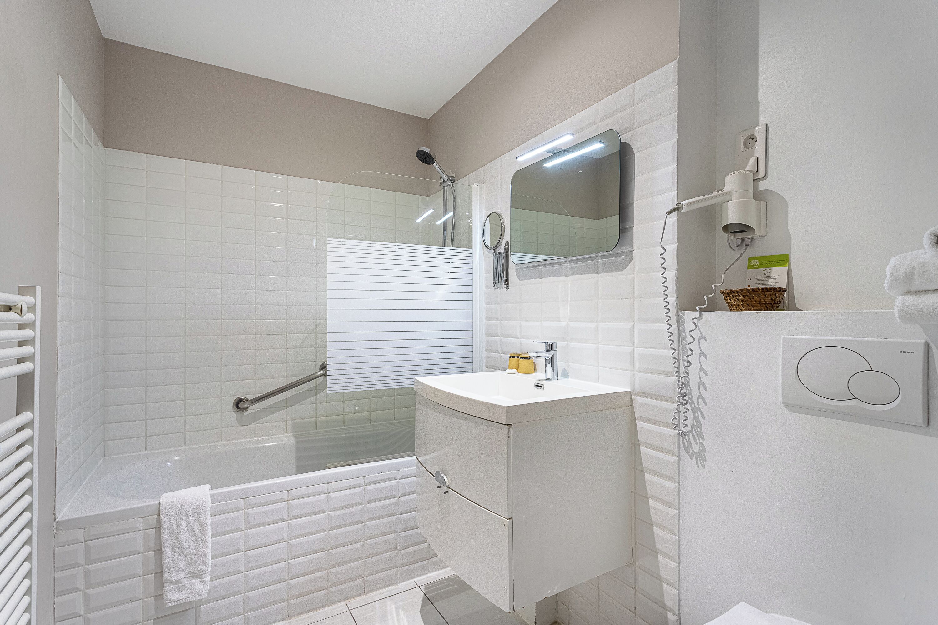 standard triple room - village view | bathroom | shower, hair dryer, towels